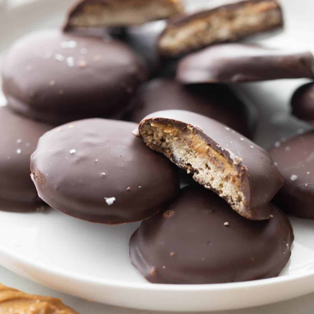 Close up of homemade tagalongs with a crispy cookie and creamy peanut butter layer.