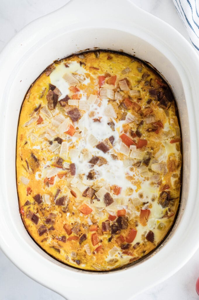 An overhead shot of a crock pot egg casserole