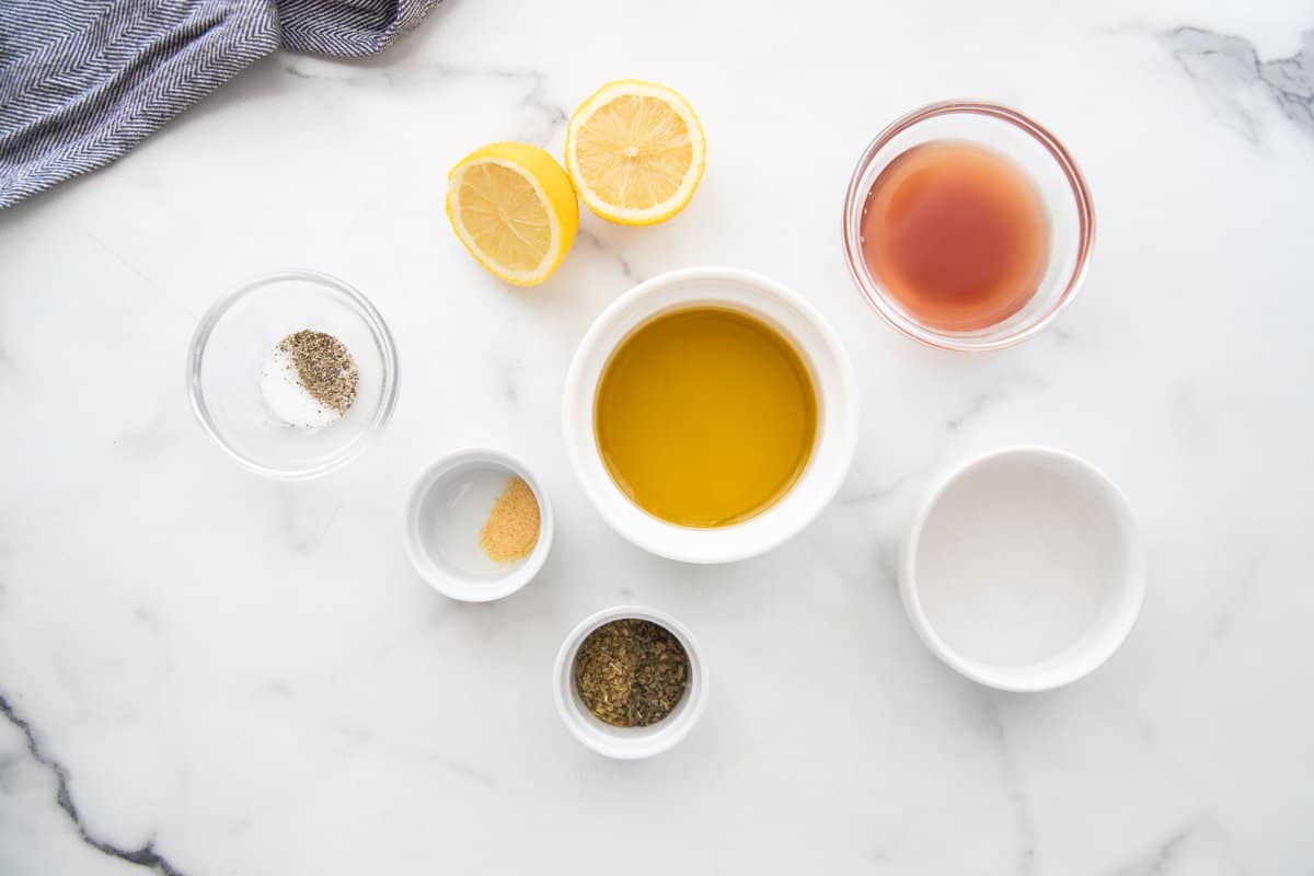 Overhead photo of bowls of ingredients used to make homemade salad dressing