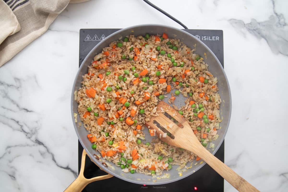 Day old brown rice in a skillet for fried rice.