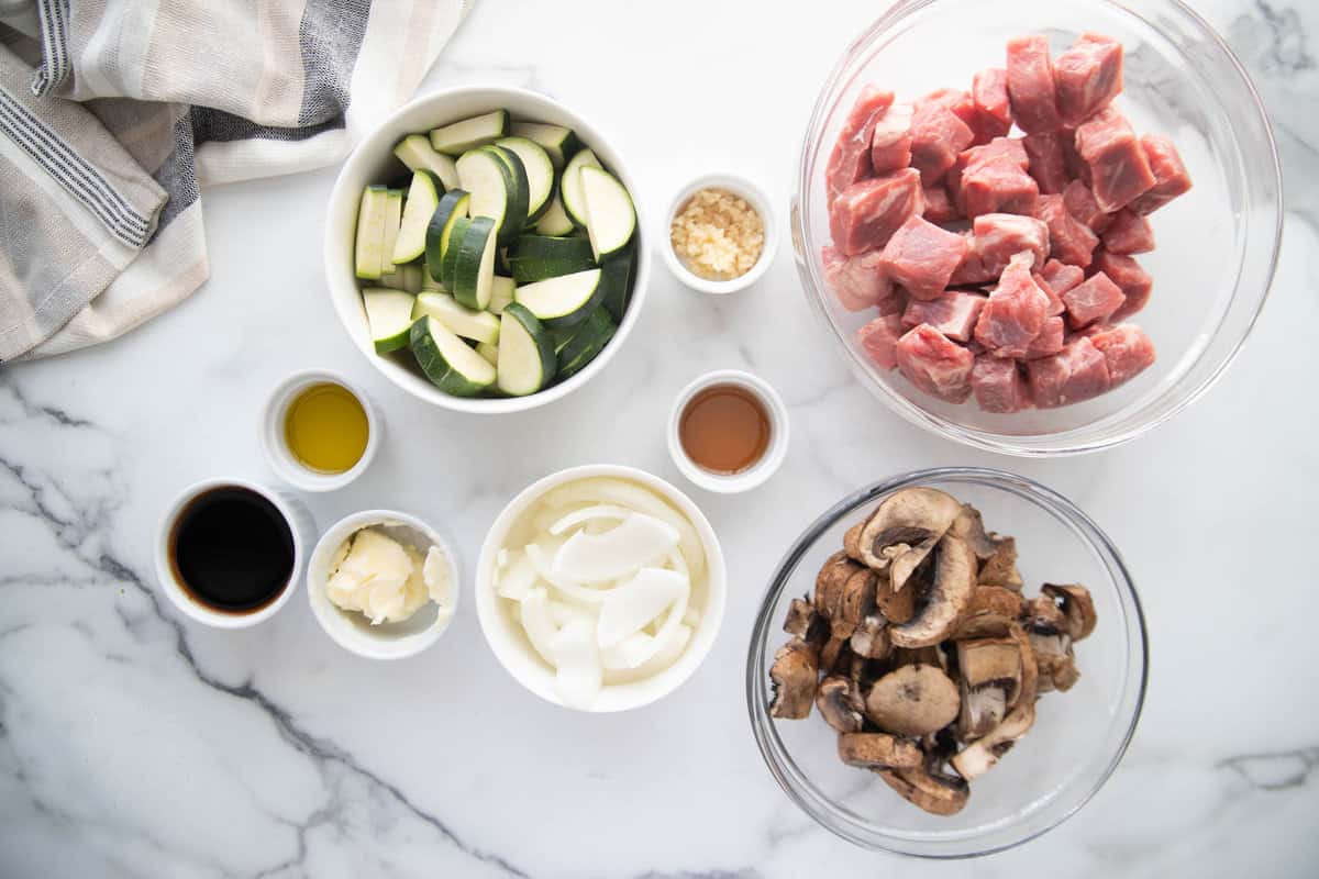 Raw hibachi steak ingredients in individual bowls.