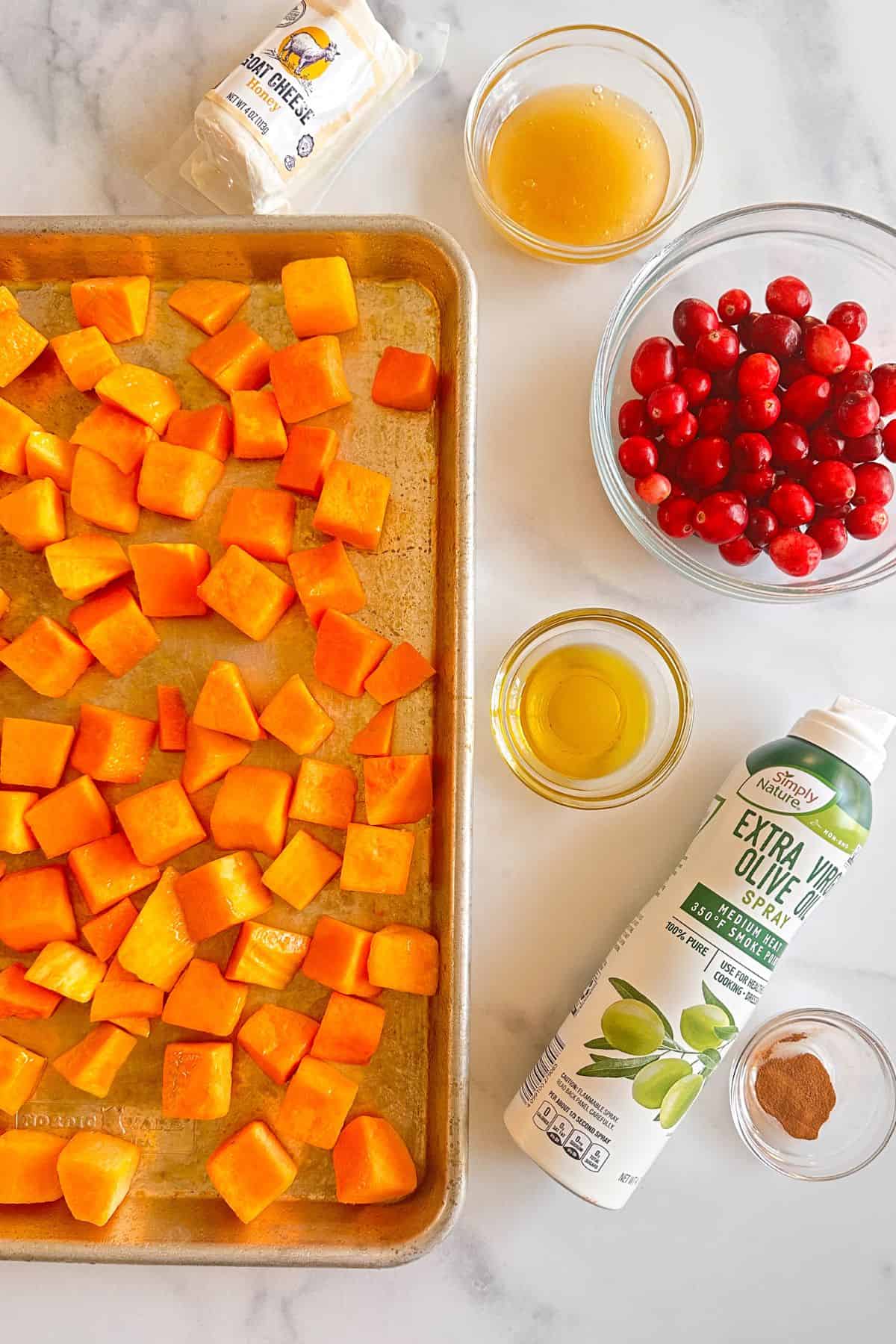 Ingredients for Roasted Butternut Squash with honey, cinnamon, cranberries, and goat cheese. 