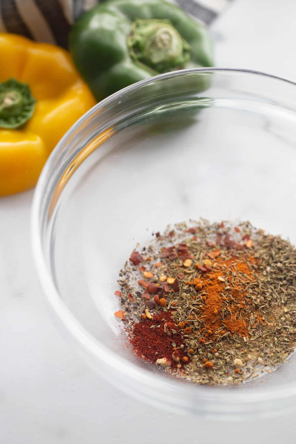 Homemade cajun seasoning in a small glass bowl.