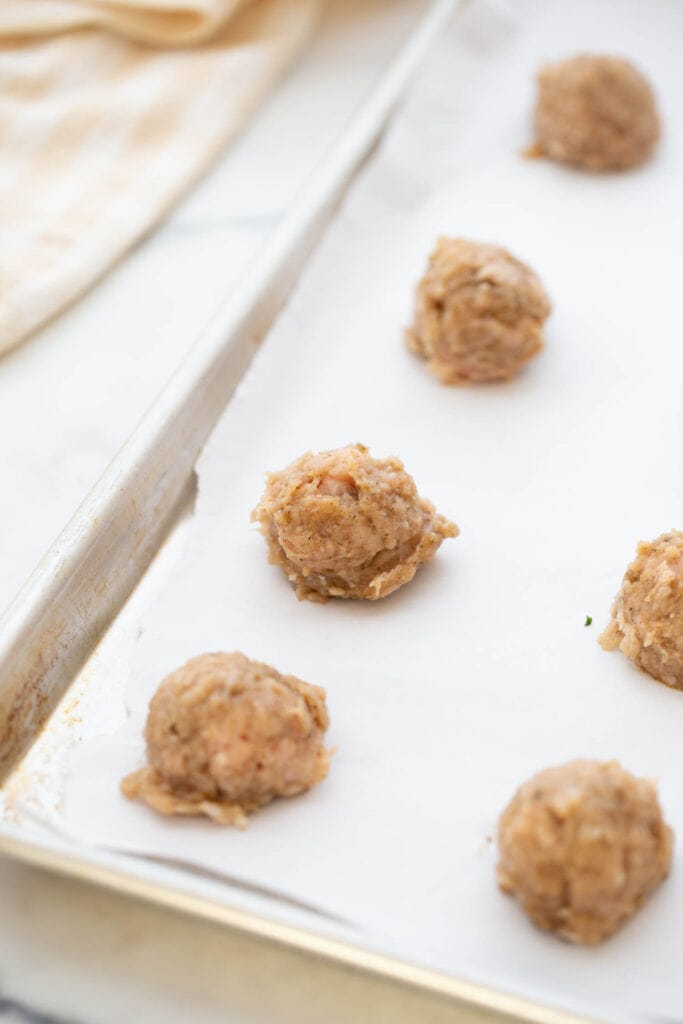 Scoops of ground chicken sausage patties.