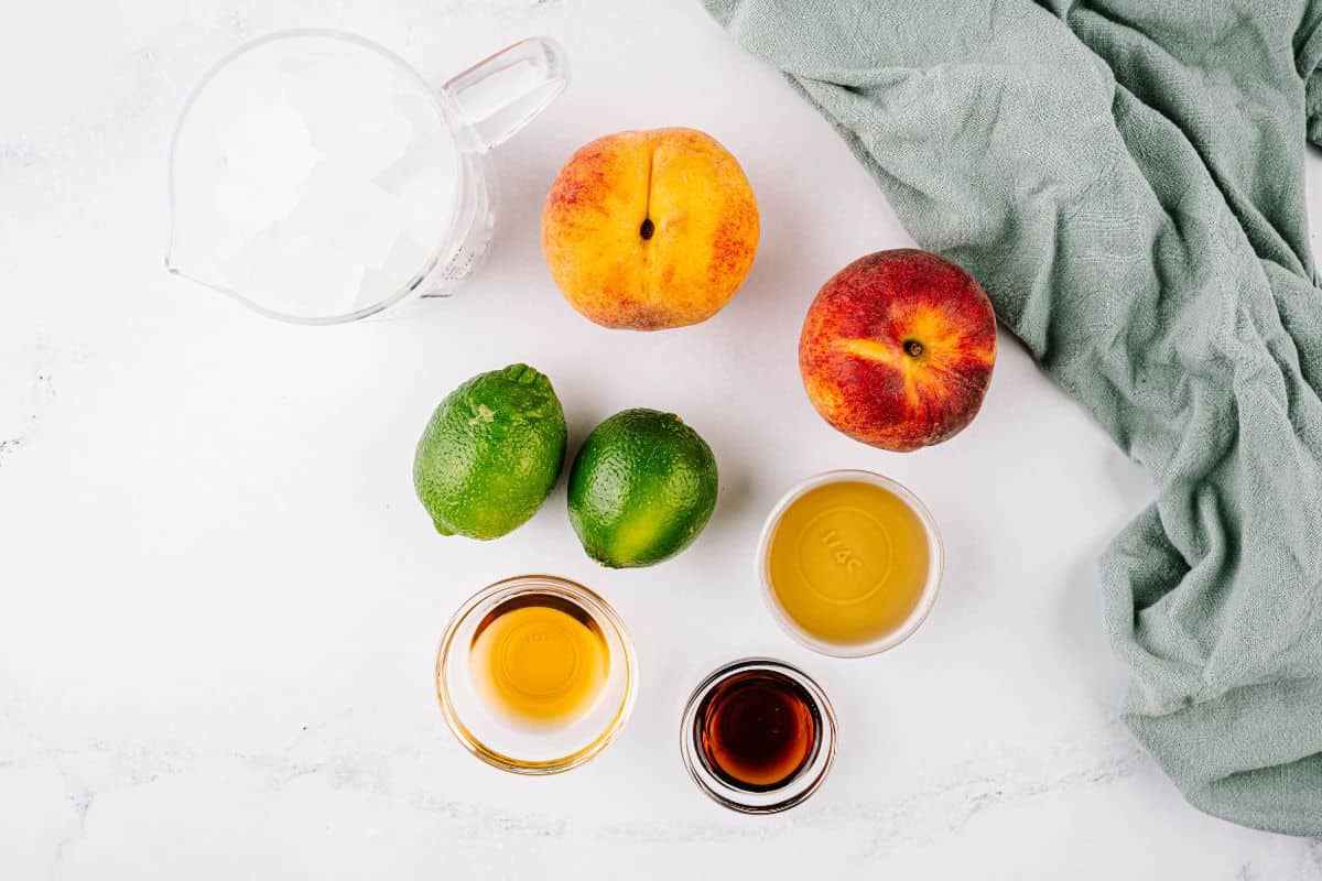 Ingredient shot for making peach margaritas with fresh peaches.