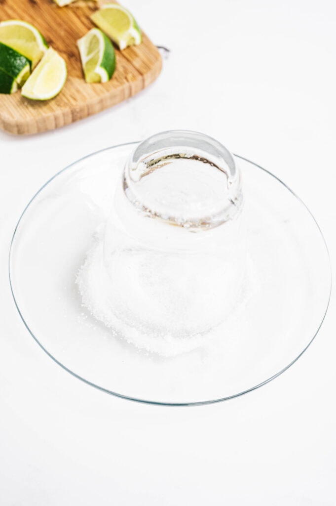 A cocktail class on a plate filled with salt