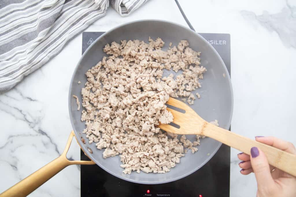 Pan of cooked ground chicken.